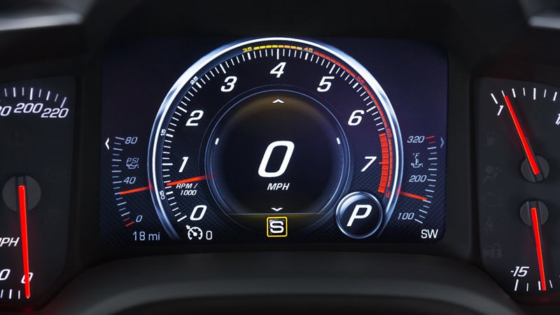 Chevrolet Corvette speedometer close-up, showcasing precision and power.