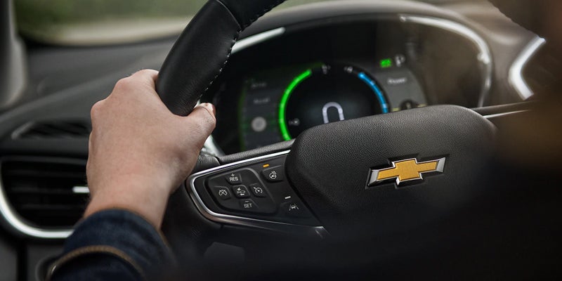 Close-up of Chevrolet Volt's advanced 7 display, classy steering wheel, and features.